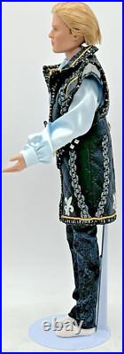 2003 Tonner Male 17 Doll Blonde Hair In Black, Gold, Blue Unmarked Outfit
