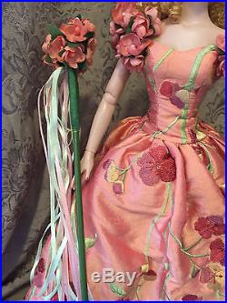 Tonner Doll wearing Wizard of Oz Glinda's Poppy Promenade outfit